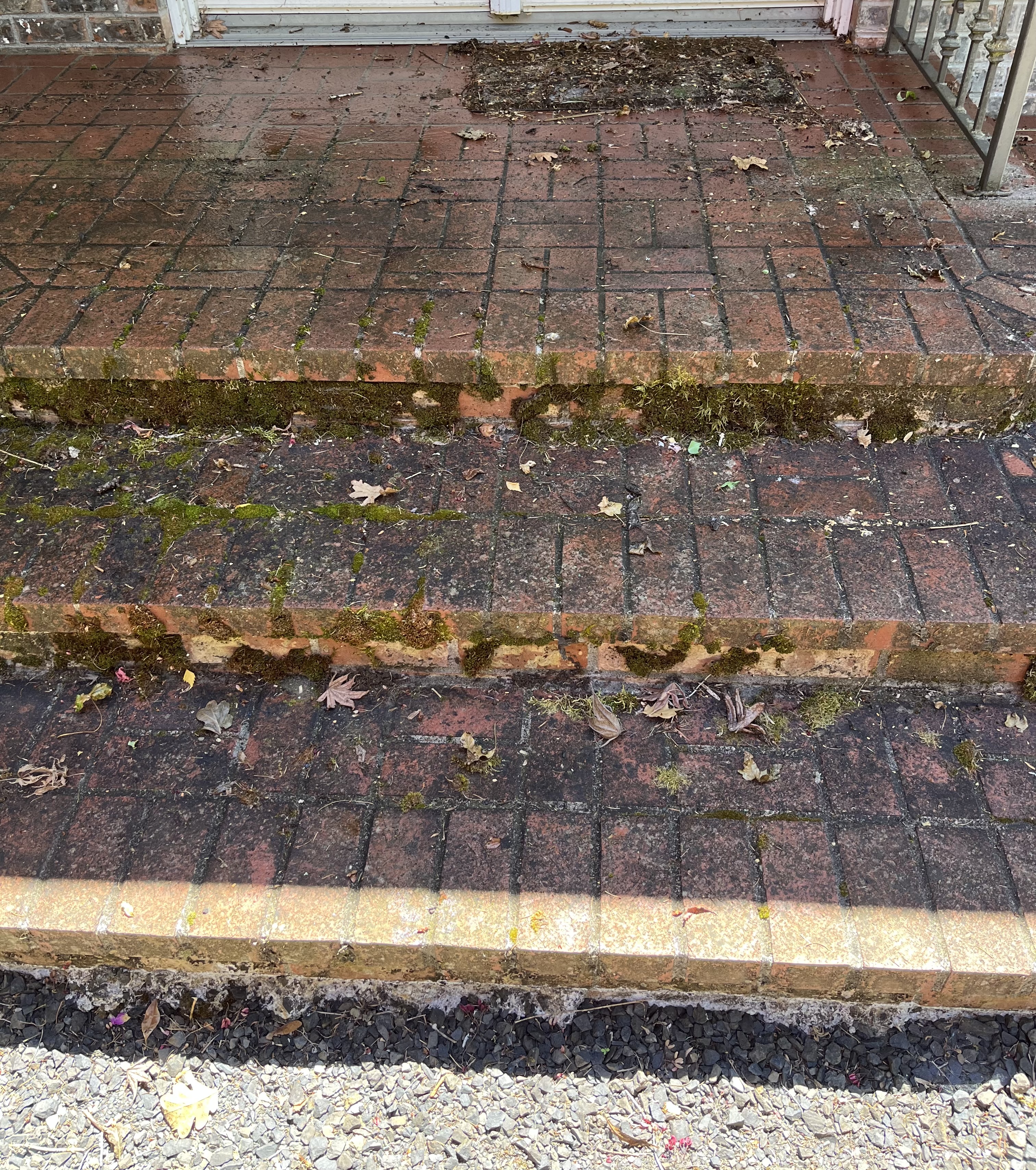 Dirty steps made of red brick.