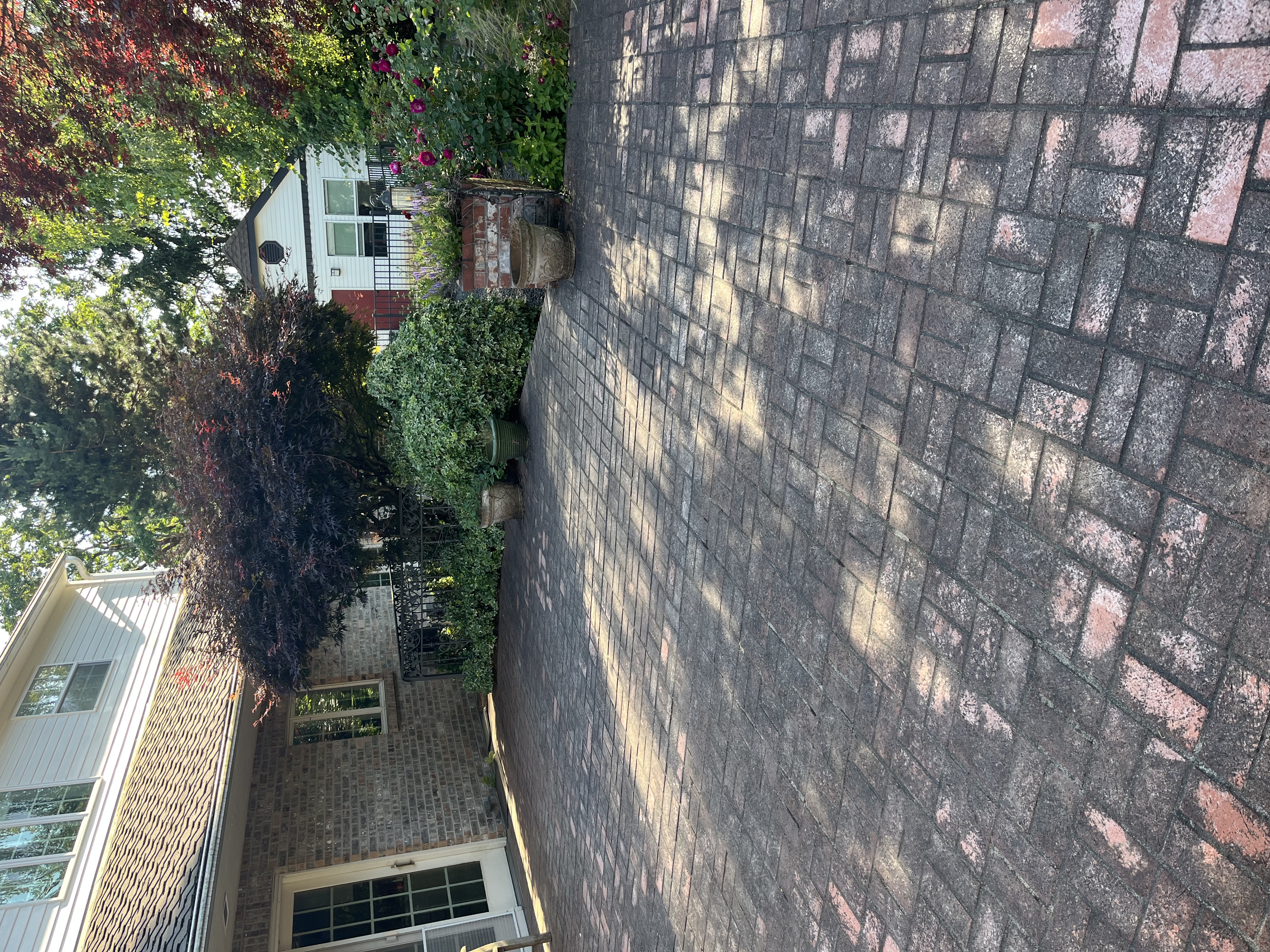 Dirty patio made of red brick.