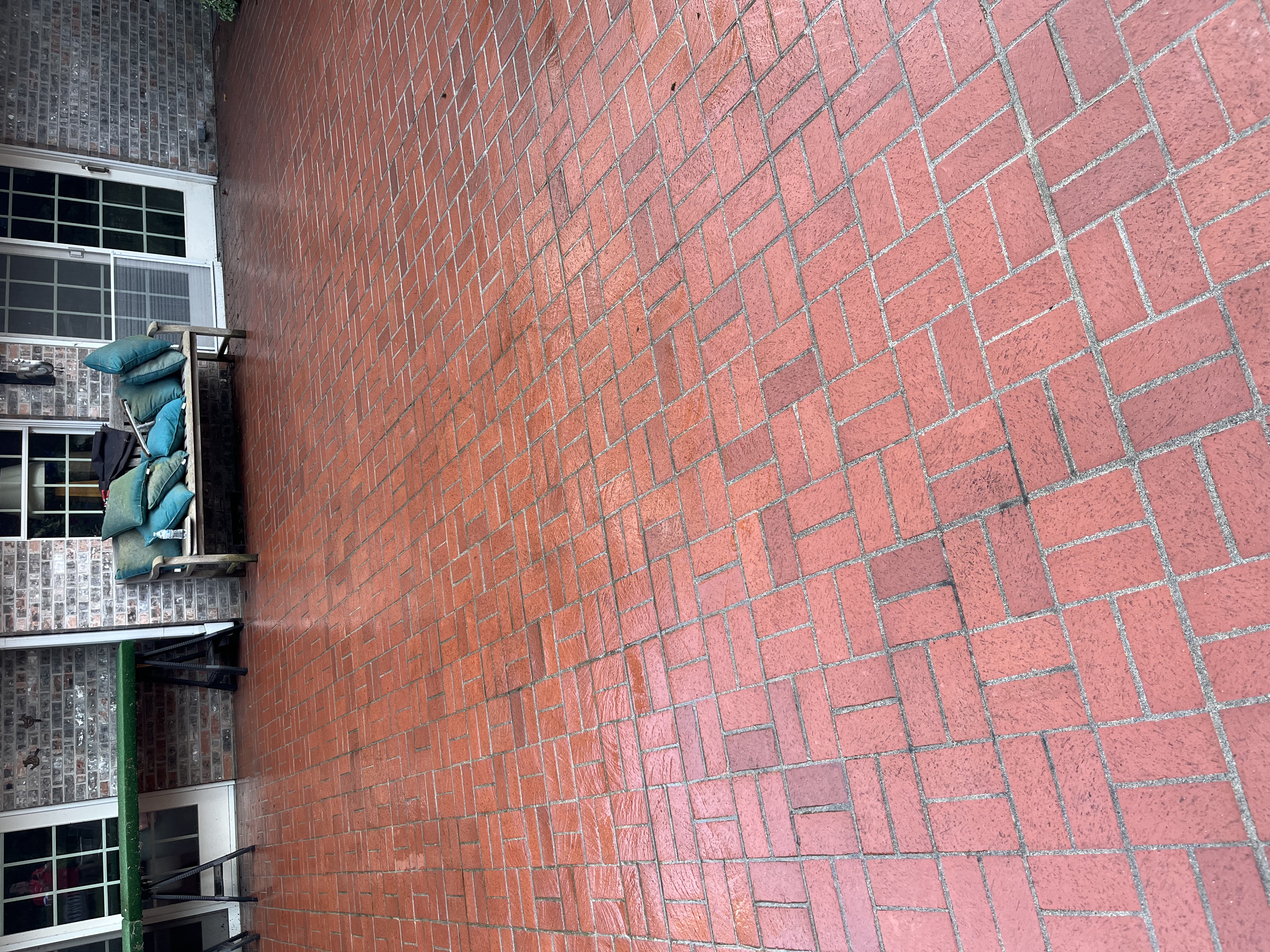 Clean patio made of red brick.
